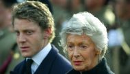 File photo of Marella Agnelli and her grandson Lapo Elkann look on as the coffin of her husband Gianni Agnelli is carried into the Turin Cathedral January 26, 2003. REUTERS/Dylan Martinez/File Photo