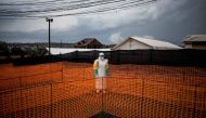 FILE PHOTO: A health worker waits to handle a new unconfirmed Ebola patient at a newly build MSF (Doctors Without Borders) supported Ebola treatment centre (ETC) in Bunia, Democratic Republic of the Congo. November 7, 2018. AFP / John WESSELS
