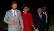 Britain's Prince Harry and Meghan, Duchess of Sussex, are welcomed by British Ambassador to Morocco Thomas Reilly and his wife Alix, at the Casablanca Airport in Casablanca, Morocco, February 23, 2019. REUTERS/Hannah McKay/Pool