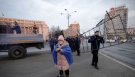 A woman, wrapped in a European Union flag takes part in a demonstration against judicial changes in Bucharest, Romania, February 24, 2019. Inquam Photos/George Calin via Reuters  