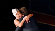 Lady Gaga and Bradley Cooper embrace after performing 