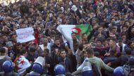 Algerian students take part in a protest against ailing President Abdelaziz Bouteflika's bid for a fifth term at Place d'Armes in the city of Oran on February 26, 2019.   AFP / STRINGER
