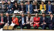 A handout photograph released by the UK Parliament shows Britain's Prime Minister Theresa May (front row 3L) reacting as she sits with members of her Cabinet during the weekly Prime Minister's Questions (PMQs) session in the House of Commons on February 2