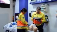 Paramedics at the Catalan regional government's stand show how a 5G ambulance functions at the Mobile World Congress (MWC) in Barcelona on February 27, 2019.  AFP / Josep Lago
 