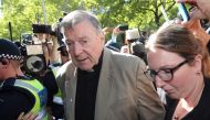 Cardinal George Pell (C) makes his way to the court in Melbourne on February 27, 2019. AFP / Con Chronis  