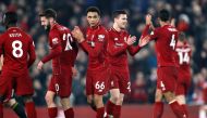 Liverpool's Trent Alexander-Arnold and team mates celebrate after the match REUTERS/Russell Cheyne 