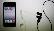 The application icons of Facebook, Twitter and Google are displayed on an iPhone next to an earphone set in this illustration photo taken in Berlin, June 17, 2013. Reuters/Pawel Kopczynski