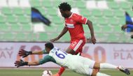 Al Arabi’s Wilfried Bony shoots to score past Al Sailiya goalkeeper Saoud Mubarak Al Khater during their QNB Stars League match played at the Al Ahli Stadium, yesterday.