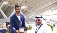 Hathab Equestrian Tour Event Director Ali Al Rumaihi presenting the winner’s award to Hussain Said Haidan.