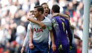 Tottenham Hotspur's English striker Harry Kane (C) celebrates with Tottenham Hotspur's Belgian defender Jan Vertonghen (L) and Tottenham Hotspur's French goalkeeper Hugo Lloris (R) after they save then block a penalty and follow-up from Aubameyang during 