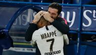 Paris Saint-Germain's French forward Kylian Mbappe (L) celebrates with Paris Saint-Germain's Italian goalkeeper Gianluigi Buffon after scoring a goal during the French L1 football match between Caen (SMC) and Paris Saint-Germain (PSG) at the Michel d'Orna