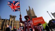 (FILES) In this file photo taken on February 27, 2019, pro-Brexit activists march outside the Houses of Parliament in central London. AFP / Tolga AKMEN