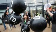 FILE PHOTO: Activists protest against the carbon dioxide emissions trading in front of the World Congress Centre Bonn, the site of the COP23 U.N. Climate Change Conference, in Bonn, Germany, November 17, 2017. REUTERS/Wolfgang Rattay
