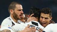 Juventus' Portuguese forward Cristiano Ronaldo (R) celebrates with his teammates his side's second goal during the Italian Serie A football match between Napoli and Juventus on March 3, 2019, at the San Paolo Stadium in Naples. / AFP / CARLO HERMANN