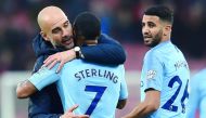Manchester City's Spanish manager Pep Guardiola (L) hugs Manchester City's English midfielder Raheem Sterling agter the English Premier League football match between Bournemouth and Manchester City at the Vitality Stadium in Bournemouth, southern England 