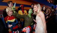 Cast member Brie Larson takes photos with fans at the premiere for the movie 