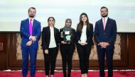 The members of winning team, Qatar University, with the officials.