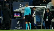 Referee Damir Skomina reviews an incident on VAR before awarding a penalty to Manchester United. Reuters/John Sibley