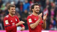 Bayern Munich's Thomas Mueller and Mats Hummels applaud the fans after the match REUTERS/Michael Dalder