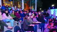 The guests enjoying the live cooking show.