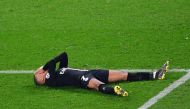 Paris Saint-Germain's French forward Kylian Mbappe reacts as he lies on the pitch at the end of the UEFA Champions League round of 16 second-leg football match between Paris Saint-Germain (PSG) and Manchester United at the Parc des Princes stadium in Pari