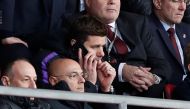 Tottenham manager Mauricio Pochettino on a phone in the stands as chairman Daniel Levy looks. Reuters/Paul Childs 