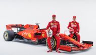 FILE PHOTO: Ferrari German Formula One driver Sebastian Vettel (C) and Ferrari Monagascan Formula One driver Charles Leclerc posing with the new Ferrari Formula One SF90.   AFP 