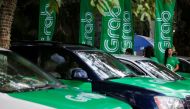 Grab cars are seen during a launch ceremony in Phnom Penh, Cambodia, December 19, 2017. Reuters/Samrang Pring