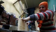 File photo: 30 years old Asmaa Megahed, a carpenter and designer, works inside her workshop in Cairo, February 27, 2017. Reuters/Amr Abdallah Dalsh