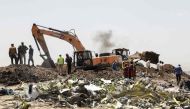 A power shovel digs at the crash site of Ethiopia Airlines near Bishoftu, a town some 60 kilometres southeast of Addis Ababa, Ethiopia, on March 11, 2019. AFP / Michael Tewelde 