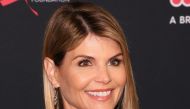 In this file photo taken on February 27, 2018, actress Lori Loughlin attends the Women's Cancer Research Fund's 'Unforgettable Evening' in Los Angeles, California. / AFP / JEAN-BAPTISTE LACROIX