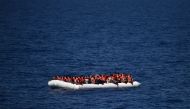 Refugees waiting on a rubber boat to be rescued during an operation at sea with the Aquarius ship now used by humanitarians on May, 24 2016 in the Mediterranean sea in front of the Libyan coast. AFP/Gabriel Bouys
 