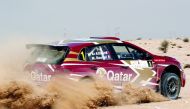 Qatari driver Nasser Saleh Al Attiyah and his French co-driver Matthieu Baumel driving a Volkswagen Polo GTI R5 on their way to win the 2019 Manateq Qatar International Rally, yesterday.