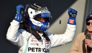 Mercedes' Finnish driver Valtteri Bottas celebrates winning the Formula One Australian Grand Prix in Melbourne in Melbourne on March 17, 2019.  AFP / Peter PARKS 