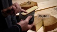 This picture taken on March 14, 2019 shows a round of cheese that has been matured for 6 month with hip hop music, on the final day of an experiment conducted by the University of the Arts in Berthoud, in the Emmental region, central Switzerland.  AFP / F