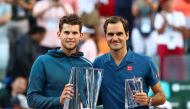 Dominic Thiem of Austria holds the championship trophy after his men's singles final victory against Roger Federer of Switzerland on day fourteen of the BNP Paribas Open at the Indian Wells Tennis Garden on March 17, 2019 in Indian Wells, California. Cliv