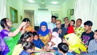 The Ambassador of Bangladesh to the State of Qatar, Ashud Ahmed, along with children cutting a cake to celebrate the 99th birth anniversary of Bangabandhu Sheikh Mujibur Rahman.