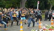 Members of a New Zealand biker gang perform the Haka to honour the victims of the mosque shootings in Christchurch, New Zealand, March 17, 2019. Picture taken March 17, 2019. REUTERS/Joseph Campbell