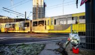 Flowers are displayed at 24 Oktoberplein, in Utrecht, on March 19, 2019, the day after three people were shot dead and several were injured in a shooting on a tram. Netherlands OUT / AFP / ANP / Robin van Lonkhuijsen