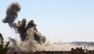 Smoke rises from the last besieged neighborhood in the village of Baghouz, Deir Al Zor province, Syria, March 18, 2019. REUTERS/Stringer