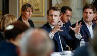 French President Emmanuel Macron gestures during a meeting with some 60 intellectuals as part of the 