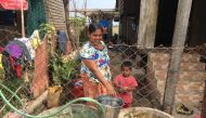 Residents fetch water in Myaing Thar Yar village, who were relocated for the Thilawa Special Economic Zone, about 23 km (9.3 sq miles) southeast of Yangon, Myanmar, February 12, 2019. Thomson Reuters Foundation/Rina Chandran