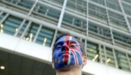 A man with painted EU and British flags on his face is seen ahead of a EU Summit in front of European Commission headquarters in Brussels, Belgium March 21, 2019. REUTERS/Yves Herman