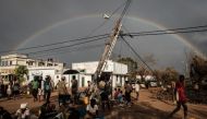 A rainbow appears in the sky in Buzi, Mozambique, on March 23, 2019, after the area was hit by the Cyclone Idai. The death toll in Mozambique on March 23, 2019 climbed to 417 after a cyclone pummelled swathes of the southern African country, flooding thou