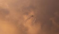 An Israeli Apache helicopter releases flares as it flies over the Gaza Strip March 25, 2019. Reuters/Mohammed Salem