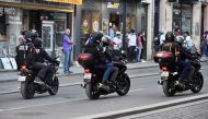 Police officers aboard motorcycles patrol in a street in Bordeaux, southwestern France, on March 23, 2019. AFP / Georges Gobet
 