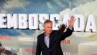 Actor Kevin Costner waves during a photocall to promote his latest film 