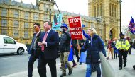 British businessman and co-founder of the Leave.EU campaign Arron Banks walks past anti-Brexit protesters outside the Houses of Parliament in London, March 27, 2019. Reuters/Henry Nicholls