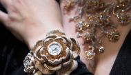 Kerstin Cook, Miss Switzerland 2010, poses with the watch with the most diamonds set on it at the Baselworld watch and jewellery fair on March 22, 2019, in Basel. The watch created by Aarum Shum Jewelery has 15, 858 dimoands set on it. AFP / Sebastien Boz