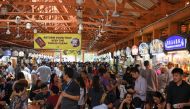 People gather at the Hawkers Centre at lunchtime in Singapore on March 28, 2019. AFP / Roslan RAHMAN